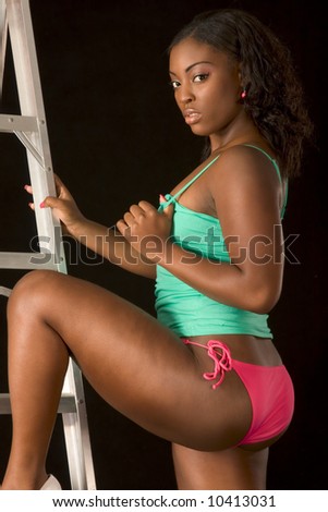stock photo Sexy Glamorous black girl in lingerie sitting with one leg on 