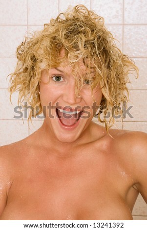 Blond girl with wet hairs after taking shower