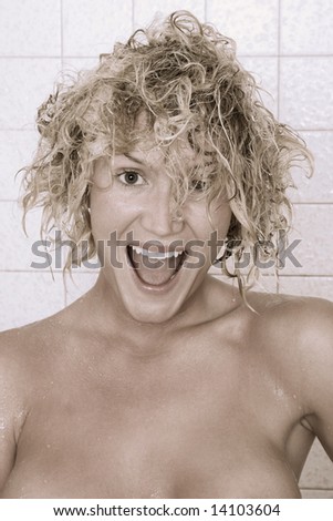 Blond woman with wet hairs after taking shower