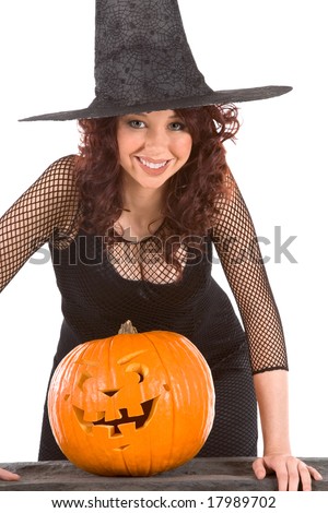  of busty Latina teenager girl in black Halloween hat and fishnet dress