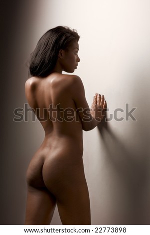 stock photo Nude young dark skinned sensuality charged Latina woman with 
