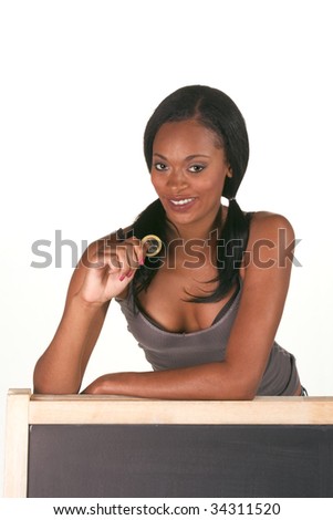 Young ethnic black female college student with condom by school chalkboard. Can be used as template for sex education themed posters or invitations