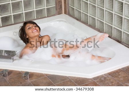 bathtub Sensual sexy female relaxing in hot tub bath with foam soap sud