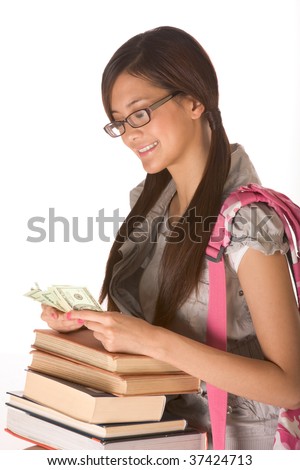 Asian young woman college student with backpack in eyeglasses and pile of books counting money