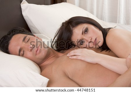 stock photo Young sexy naked heterosexual couple in love sleeping in bed