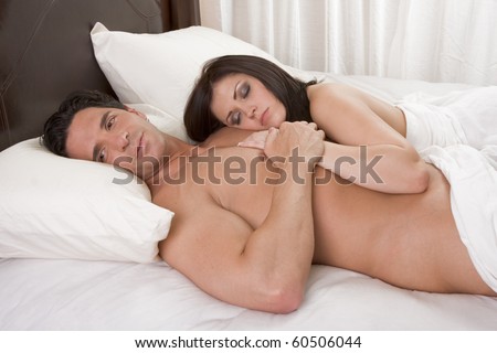 stock photo Young sexy naked heterosexual couple in love sleeping in bed