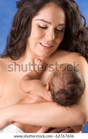 stock photo naked Hispanic mom holding her biracial mix of Hispanic and