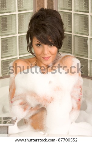 bathtub Sensual sexy female relaxing in hot tub bath with foam