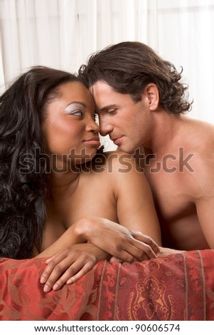 Interracial Lovers - sensual heterosexual couple making love. African-American black woman and Caucasian man