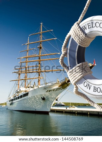 view on the sailing ship true blue safe belt with welcome on board sign