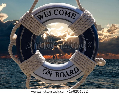 view on the sailing ships in sunset through blue safe belt with welcome on board sign