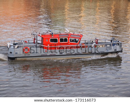 LONDON - JANUARY 21 2014: A fire and rescue boat on the river Thames on January 21  2014 in London