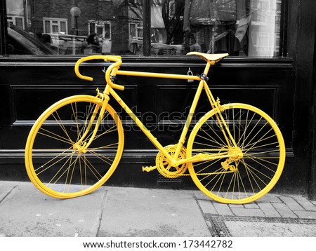 B&Amp;W Photo Of Old Yellow Bike On The Window Of The Coffee Shop