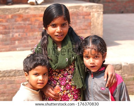 BHAKTAPUR, NEPAL - MAR 5 : Unidentified smiling girls on Mar 5, 2013 in Bhaktapur, Nepal. Bhaktapur is listed as a World Heritage by UNESCO for its rich culture, temples, and wood artwork.