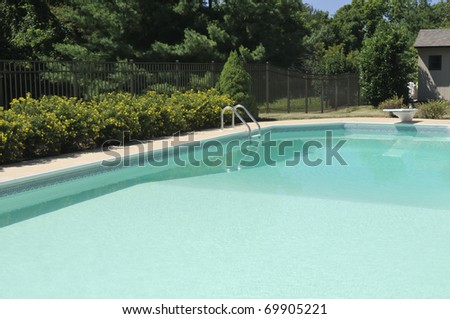 Backyard pool with diving board