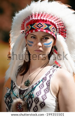 Young woman in war bonnet headdress of American Indian