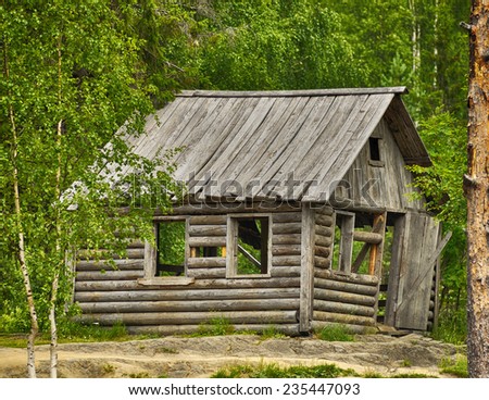 Old typical Russian wooden house in the forest