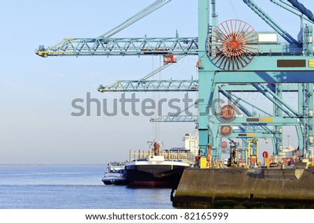 harbor cranes and transport ship in the port of antwerpen