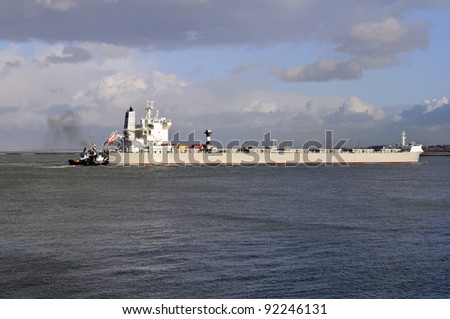 oil tanker and pilot boat assist coming in the harbor of rotterdam netherlands