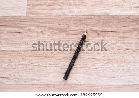 pencil with multicolor pencil lead on wooden background