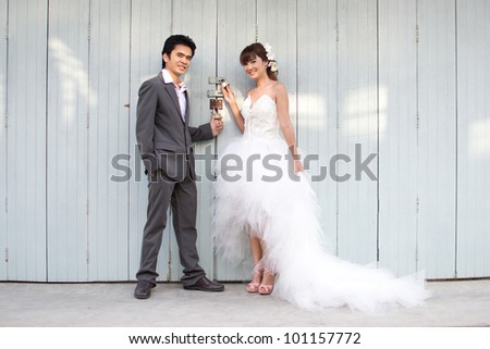 Asian couple with wedding scene out door background.