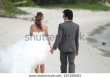 Asian couple with wedding scene out door background.