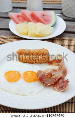 set of american breakfast on wood table.