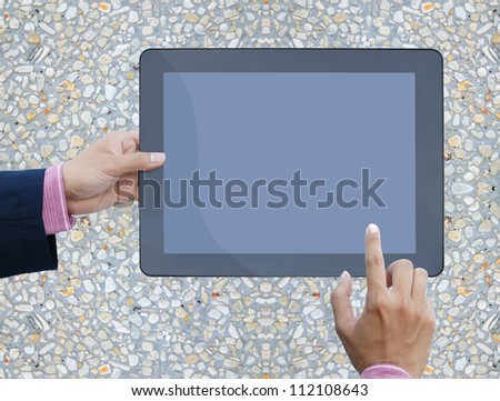 art work hand of business man hold the touch screen computer  on stone background