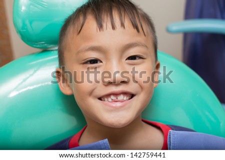 Asain kid at the dentist clinic.