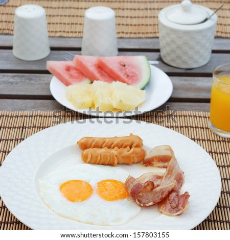 set of american breakfast on wood table.