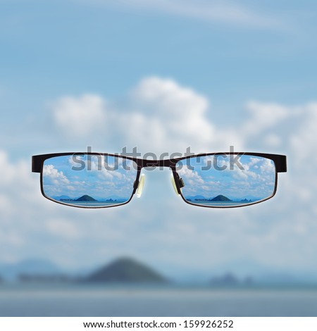 vision concepts by clear view eye glasses with out of focus background.