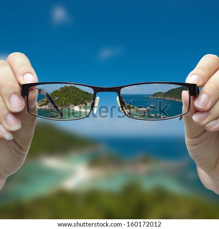 vision concepts by clear view eye glasses with out of focus background.