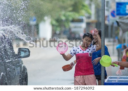 KO SAMUI, THAILAND - APRIL 13: Foreigners and Thai people enjoy splashing water together in songkran festival on April 13, 2014 in Ko Samui island, Thailand.