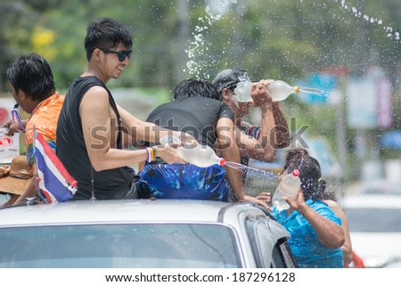 KO SAMUI, THAILAND - APRIL 13: Foreigners and Thai people enjoy splashing water together in songkran festival on April 13, 2014 in Ko Samui island, Thailand.