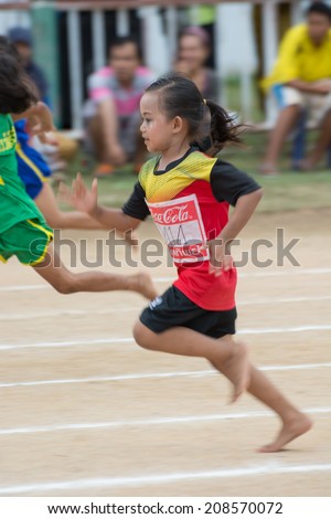 KO SAMUI,SURAT THANI - JULY 22 : Unidentified Thai students 4 - 8 years old athletes in action during sport day on July 22, 2014 in ko samui, Surat Thani, Thailand.