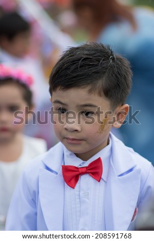 KO SAMUI,SURAT THANI - JULY 22 : Unidentified Thai students 4 - 8 years old in ceremony uniform during sport parade on July 22, 2014 in ko samui, Surat Thani, Thailand.