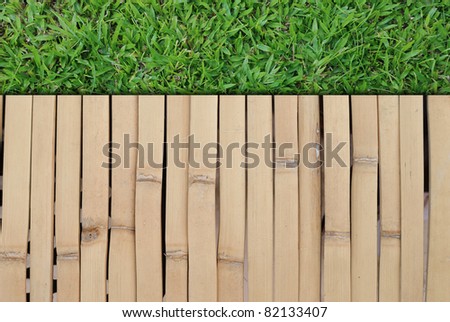 grass field and wood wall background picture for general background usage.