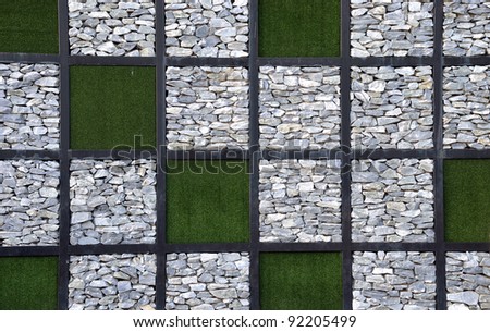 mixed artificial grass and stone pattern on the wall.