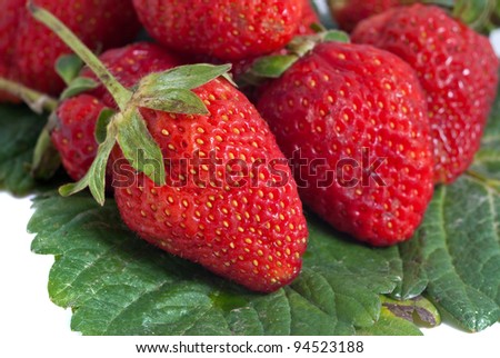 Fresh strawberry stack on leave over white background.