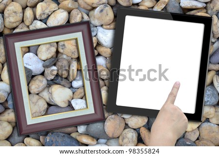 Artwork of tablet computer with hand and photo frame on nature background.