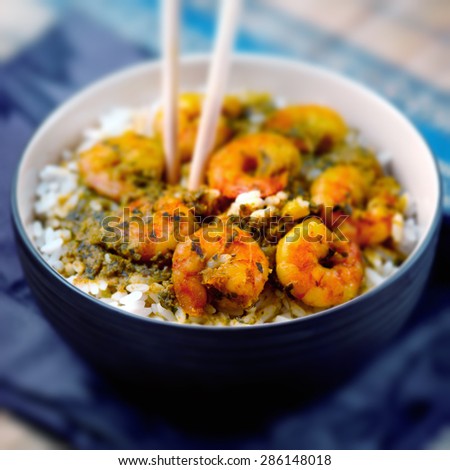 Curry prawns shrimp and rice in a bowl Caribbean food