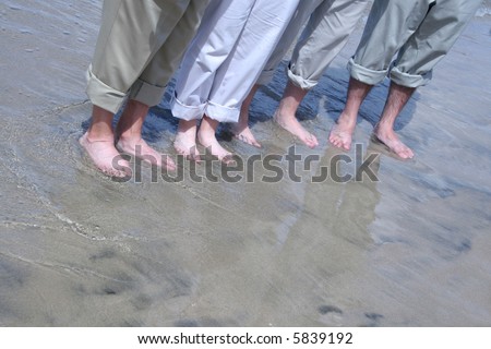 Casual Friday - People with khaki pants standing on beach