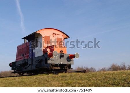 Old diesel locomotive parked for display.