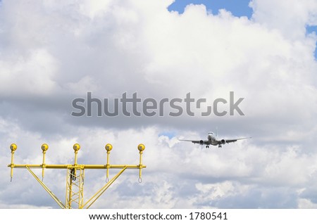 Airplane approaching the runway lights.