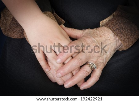 Care concept, young and elder hands