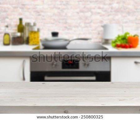 Wooden table on defocused rustic kitchen background