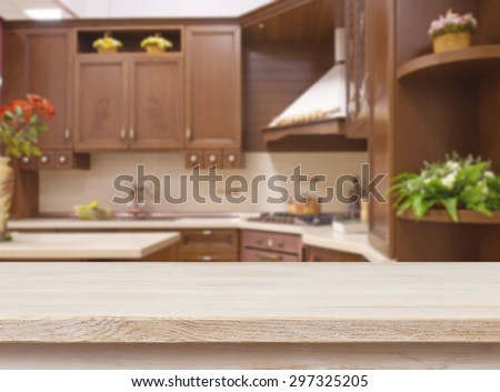 Dining table on blurred brown kitchen interior background