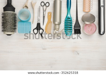 Professional hairdressing tools and accessories with copyspace at the bottom