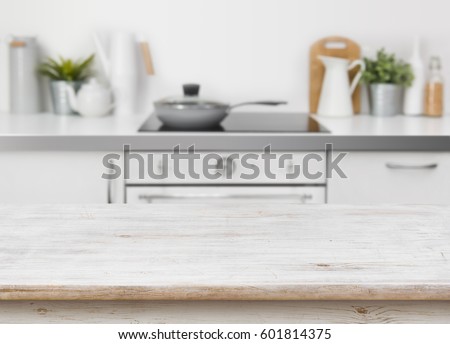 Bleached wooden texture table on defocused kitchen bench interior background