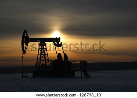 Oil production. Oil pumps at sunset